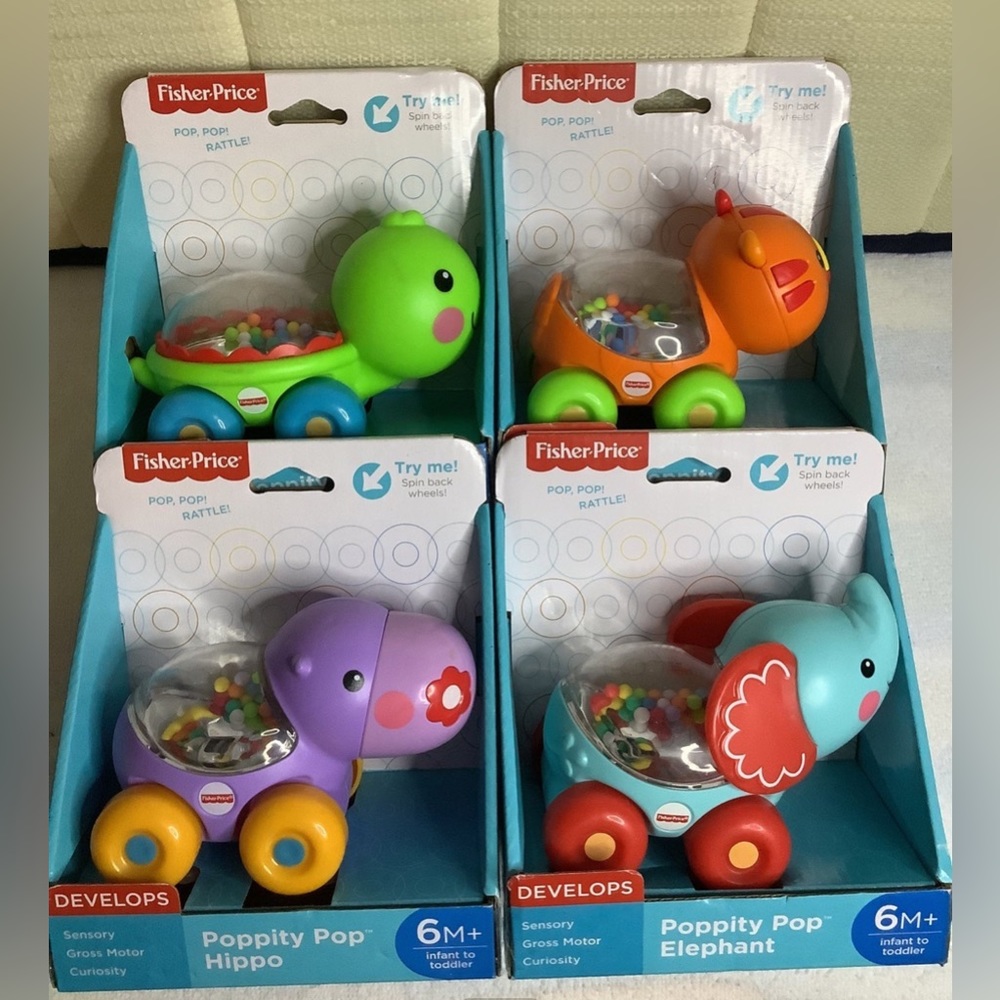 Fisher Price poppity pop: turtle, tiger, hippo, elephant. Pack of 4